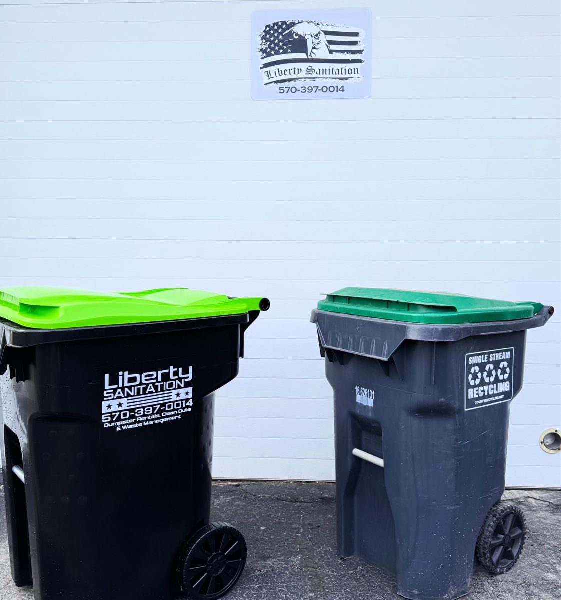 Liberty Sanitation branded black trash tote with the phone number 570-397-0014